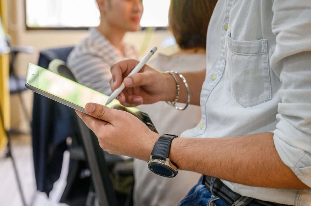 A coach taking notes on an app