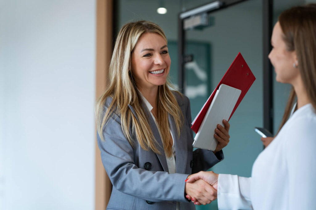 A coach welcoming a new client starting their coaching program.