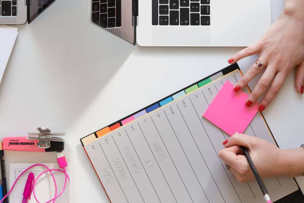 A-coach-writing-a-plan-for-their-coaching-business-clients-1 | upcoach coaching platform A coach writing a plan for their coaching business clients.