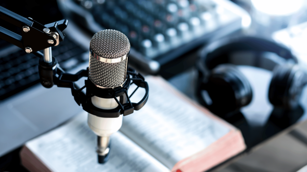 Coach recording a podcast episode with a good podcast mic, podcast equipment,  and podcast editing software